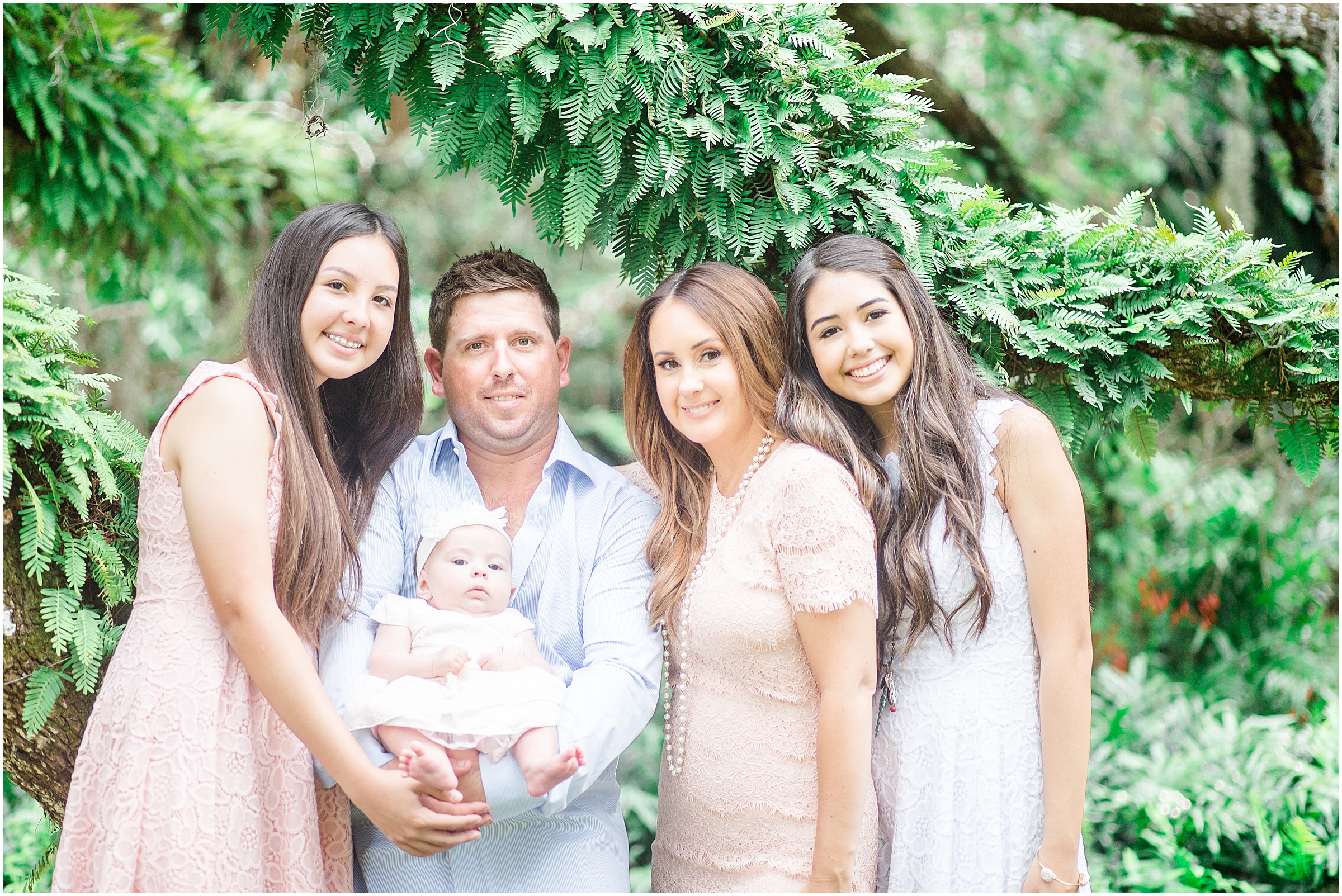 Jessica & Brad, along with their family, take photos at Bok Tower Gardens in Lake Wales, Florida.