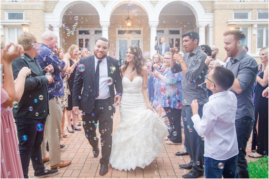 Bride & Groom exit through a sea of bubbles outside the Sorosis Building in Lakeland, Florida.